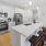 a kitchen with white cabinets