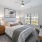 a bedroom with a bed and a desk