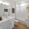 a bathroom with a tub sink and toilet