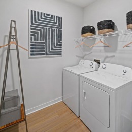 Everything within reach a laundry room with a washer and dryer