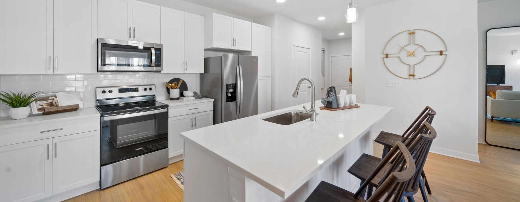 a kitchen with white cabinets